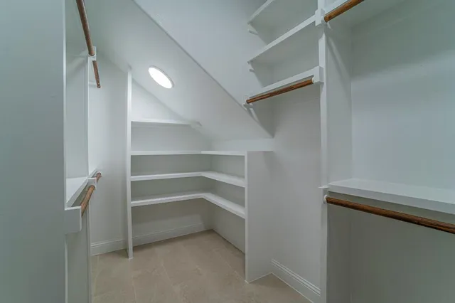 a view of an empty walk in closet