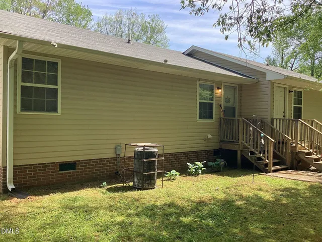 a view of a backyard of the house