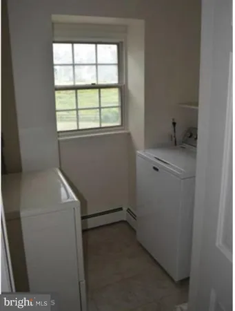 a utility room with a window dryer and washer