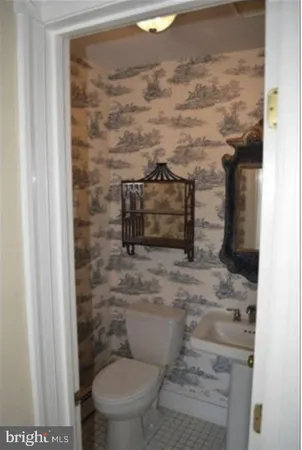 a bathroom with a toilet and a sink