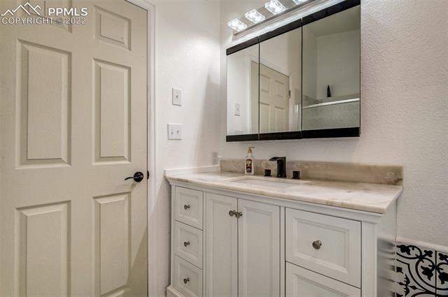 38620 Trogilo Road Rush, CO 80833 - Photo 19 of 33 MASTER BATH-PEEK OF FREE STANDING SHOWER IN MIRROR!