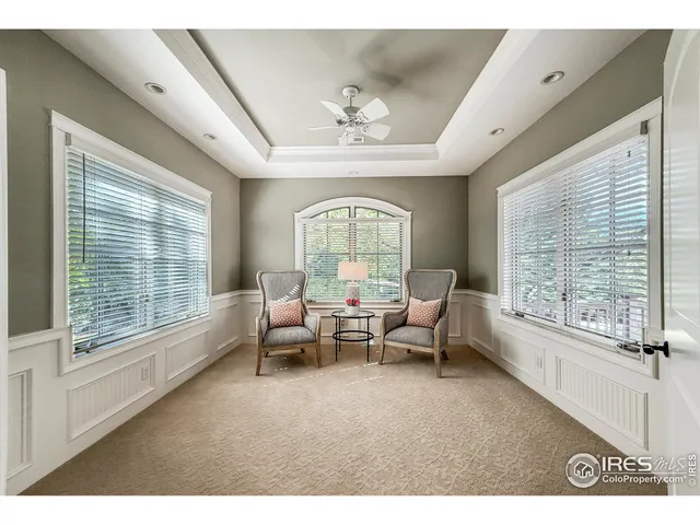 a bathroom with a tub a sink and mirror