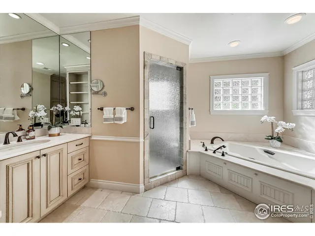 a bathroom with a granite countertop sink mirror and shower