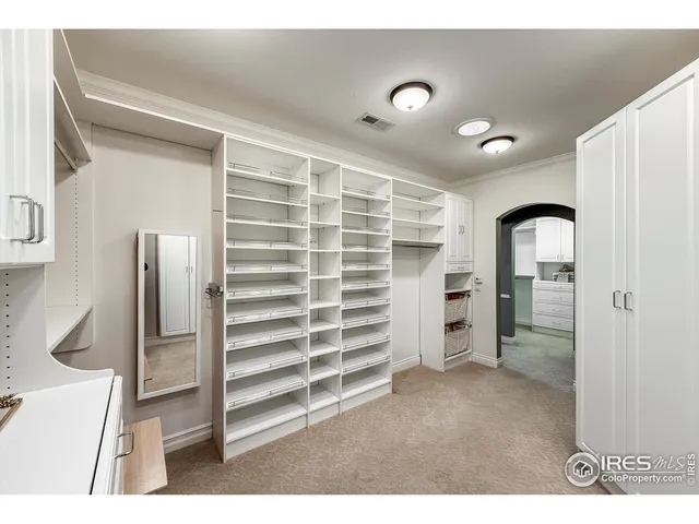 a cabinet with white cabinets