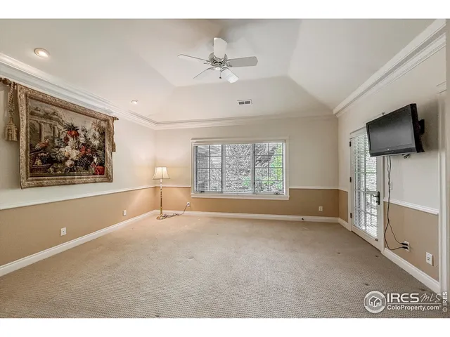 a bathroom with a granite countertop sink toilet and mirror