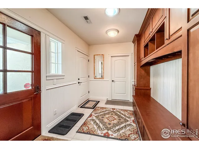 a kitchen with cabinets and white appliances