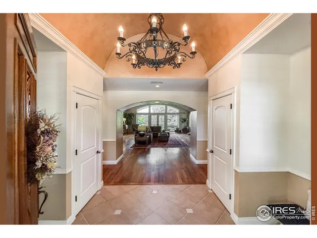 a view of a livingroom kitchen and entryway