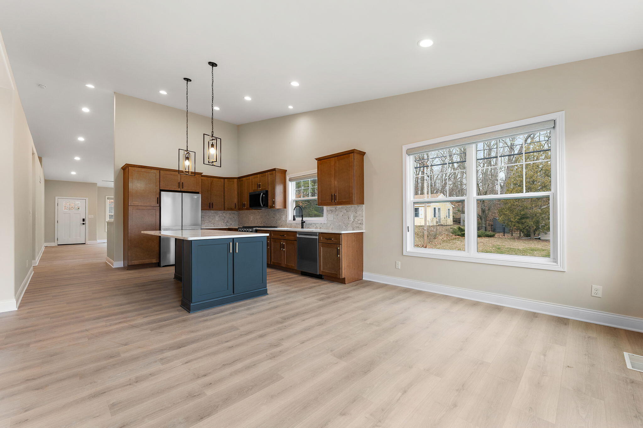 1504 Waverly Road Porter, IN 46304 - Photo 11 of 25 a large kitchen with stainless steel appliances kitchen island a large counter top and a wooden floors