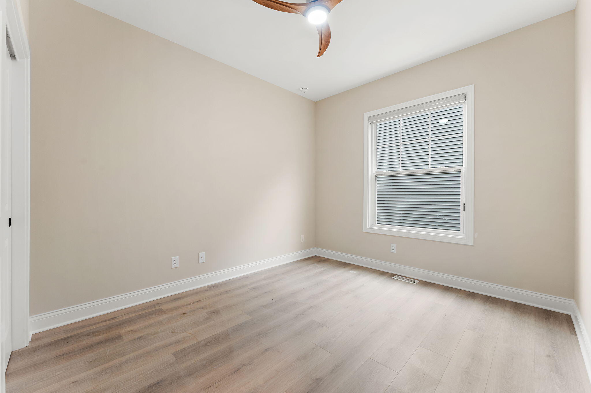 1504 Waverly Road Porter, IN 46304 - Photo 12 of 25 wooden floor in an empty room with a window