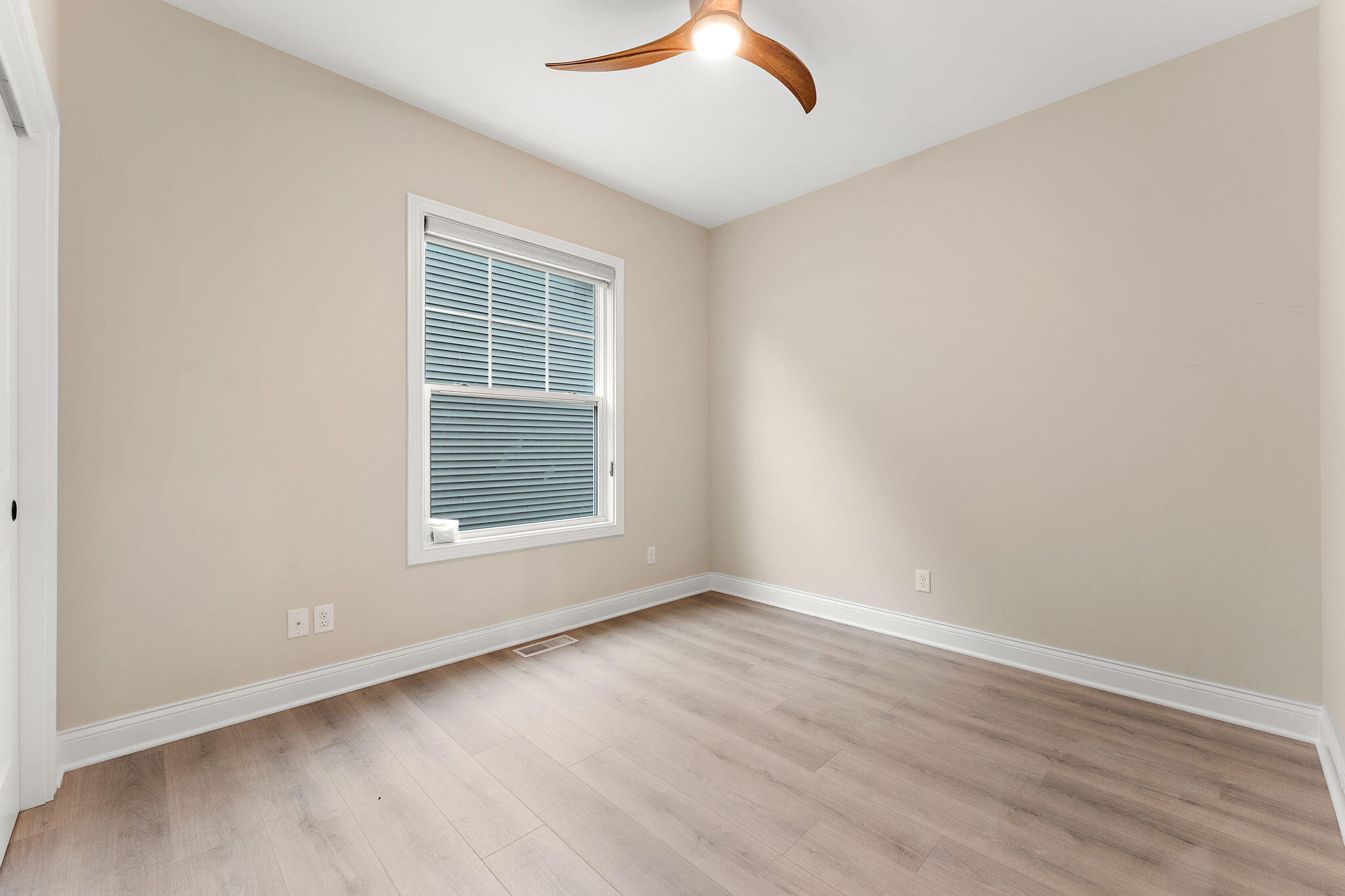 1504 Waverly Road Porter, IN 46304 - Photo 13 of 25 an empty room with wooden floor and windows