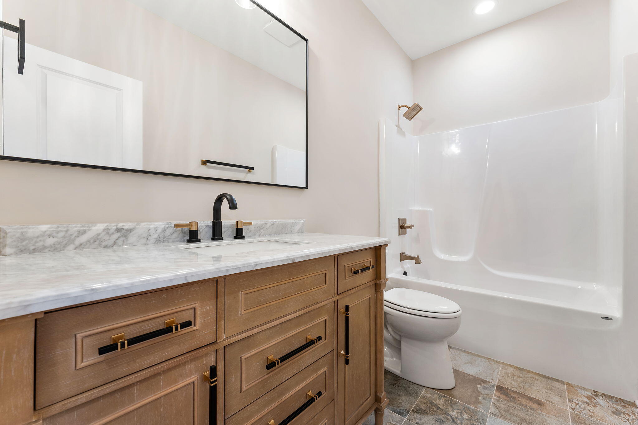 1504 Waverly Road Porter, IN 46304 - Photo 14 of 25 a bathroom with a granite countertop sink a toilet and a bathtub