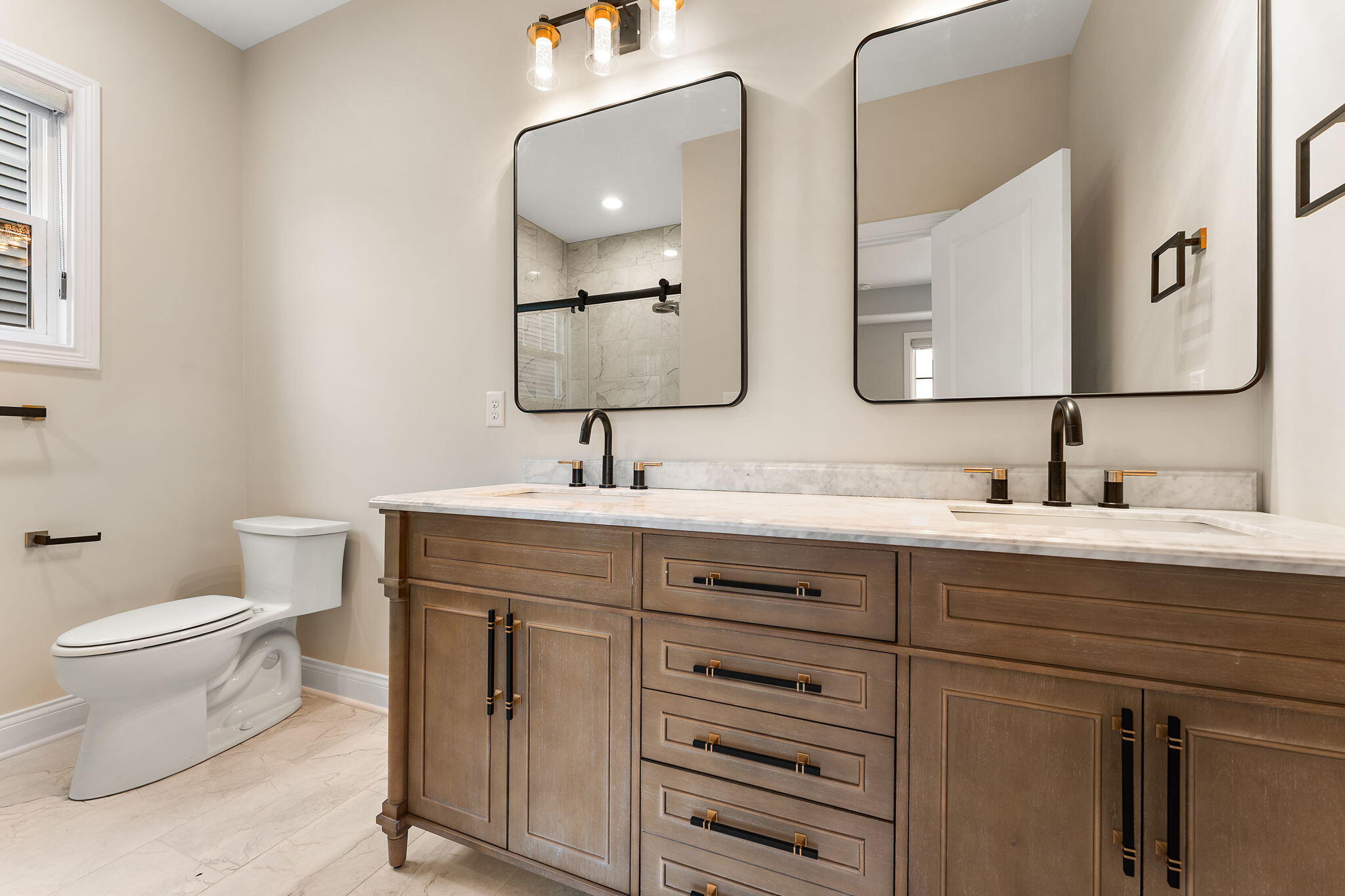 1504 Waverly Road Porter, IN 46304 - Photo 19 of 25 a bathroom with a toilet sink and mirror