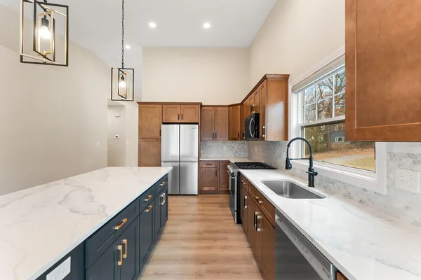 a kitchen with sink cabinets and stove