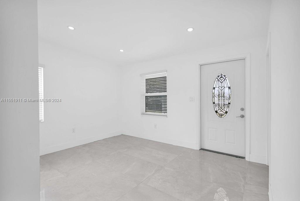 2370 Service Road Opa-Locka, FL 33054 - Photo 15 of 28 an empty room with painting on the wall