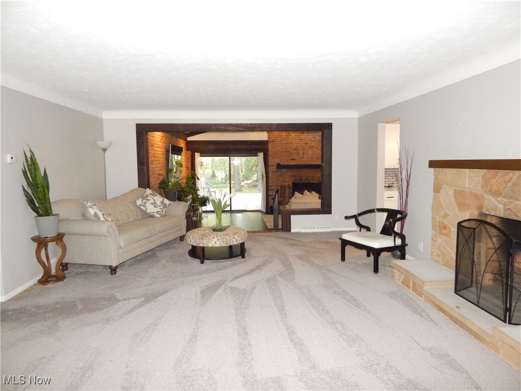 2128 Miami Road Euclid, OH 44117 - Photo 16 of 36 Carpeted living room featuring a fireplace
