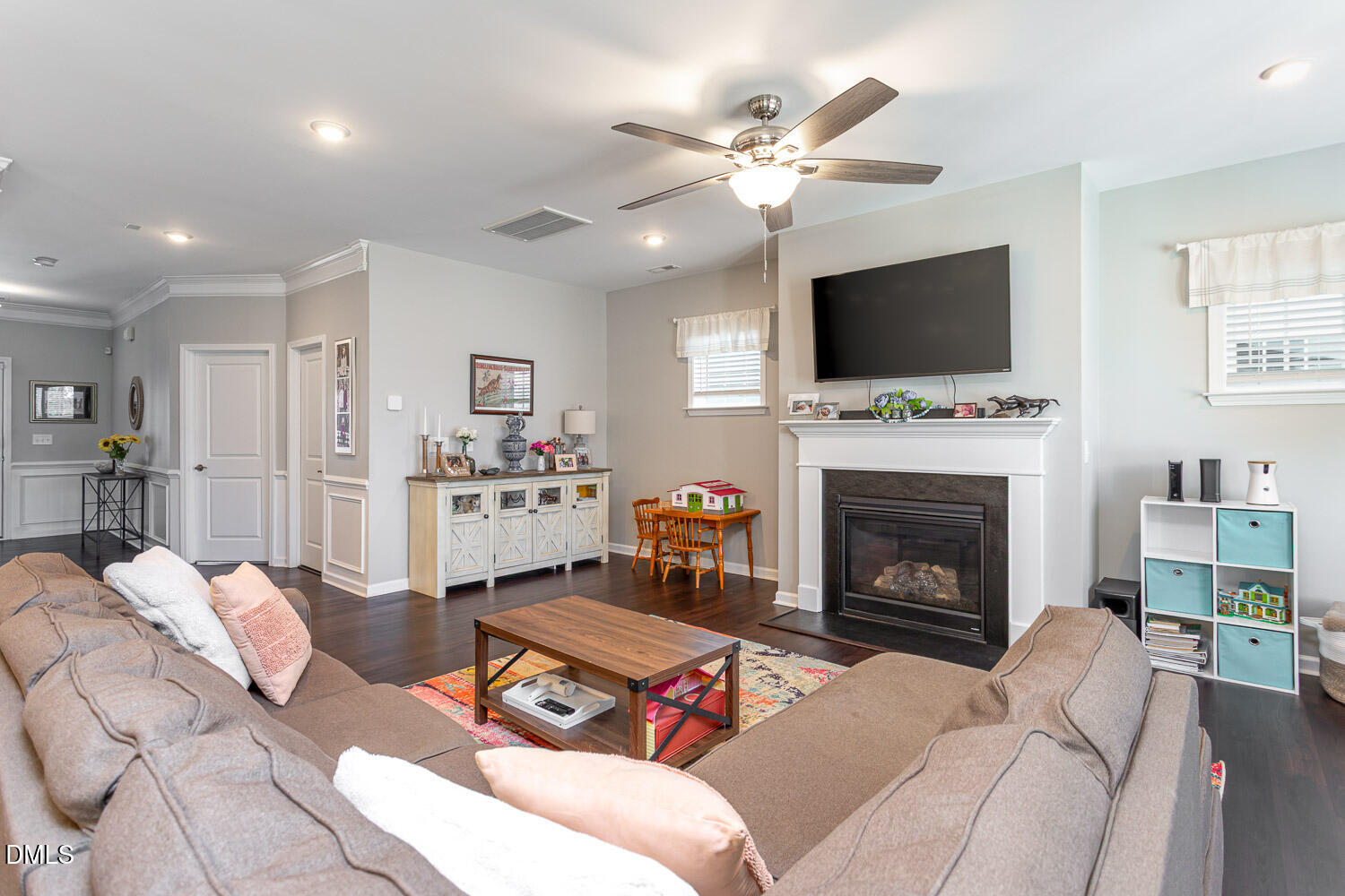 1708 Highpoint Street Wake Forest, NC 27587 - Photo 10 of 63 a living room with furniture a flat screen tv and a fireplace