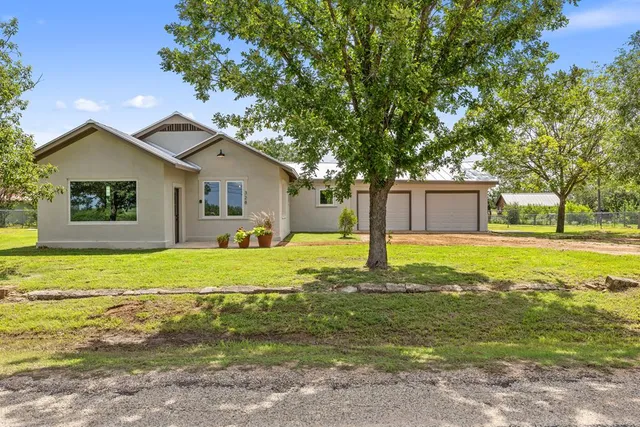a house view with swimming pool