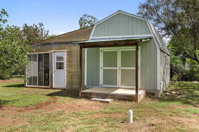 a view of a tree in a yard