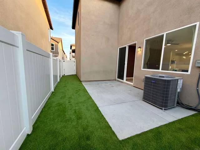 a view of backyard with tub and stairs