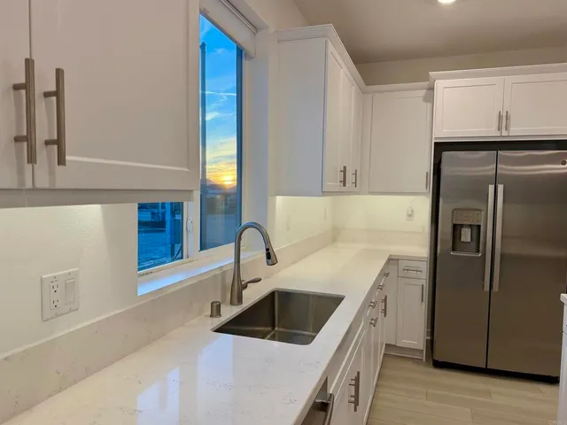 a kitchen with a sink and a microwave