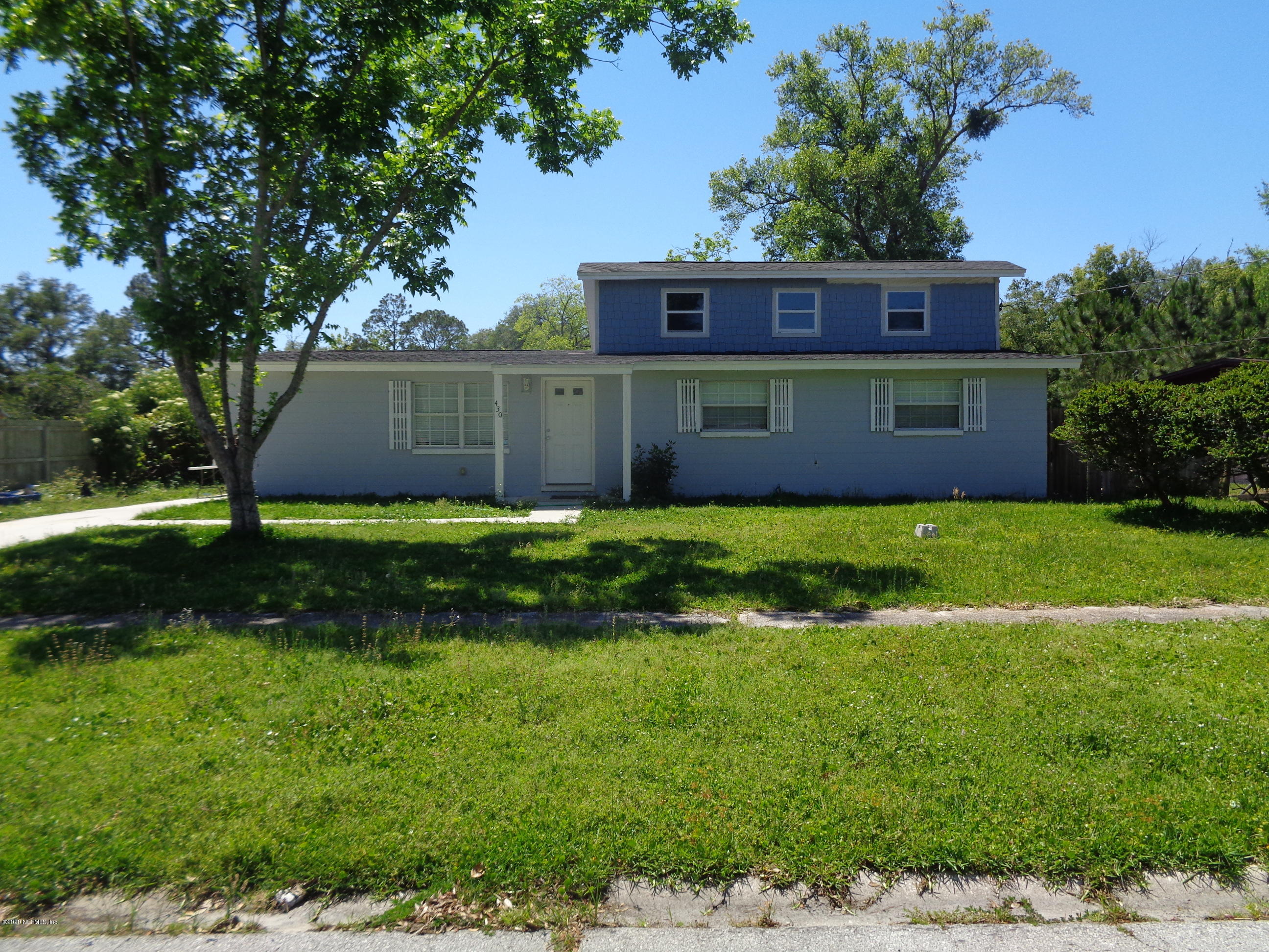 430 Sigsbee Road Orange Park, FL 32073 - Photo 1 of 1 a view of a house with a yard potted plants and large tree