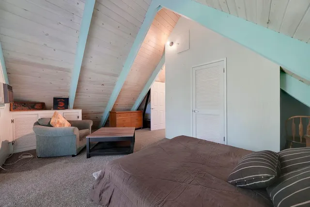 a bedroom with furniture and a fireplace