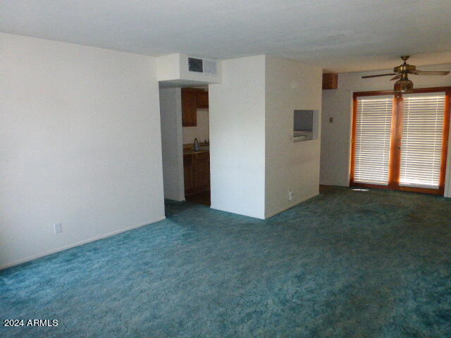 301 Fairhaven Road Kearny, AZ 85137 - Photo 8 of 35 an empty room with closet and windows
