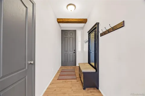 a hallway with a door and couch