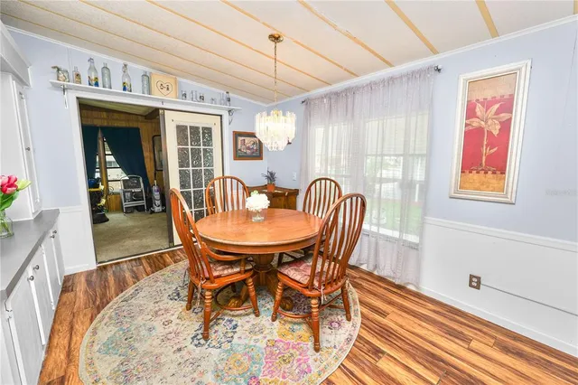 a dining room with furniture and window