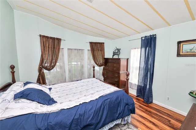 a bed room with a bed and a dresser