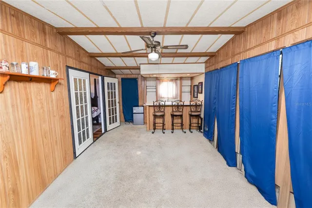 a view of a dining room with furniture and window