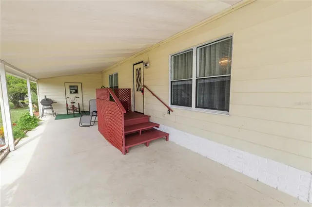 a balcony view with furniture and wooden floor
