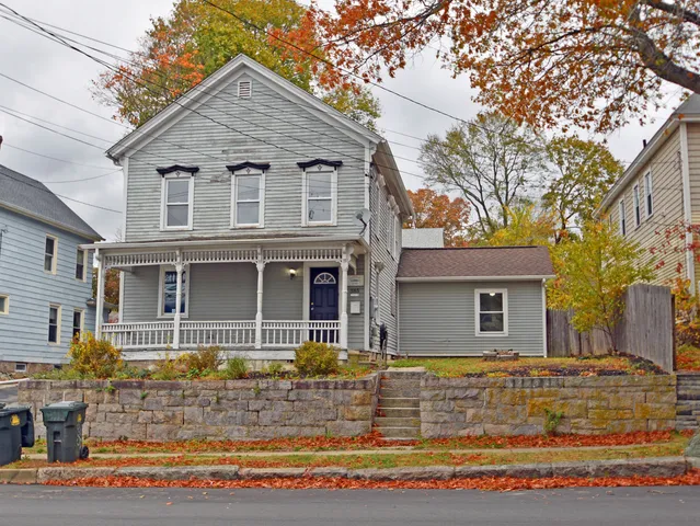 a front view of a house with garden