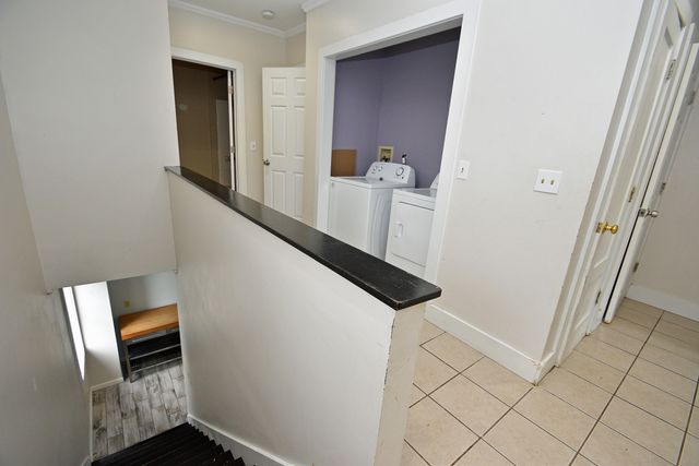 a view of front door and wooden floor