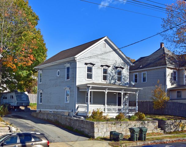 a front view of a house with swimming pool
