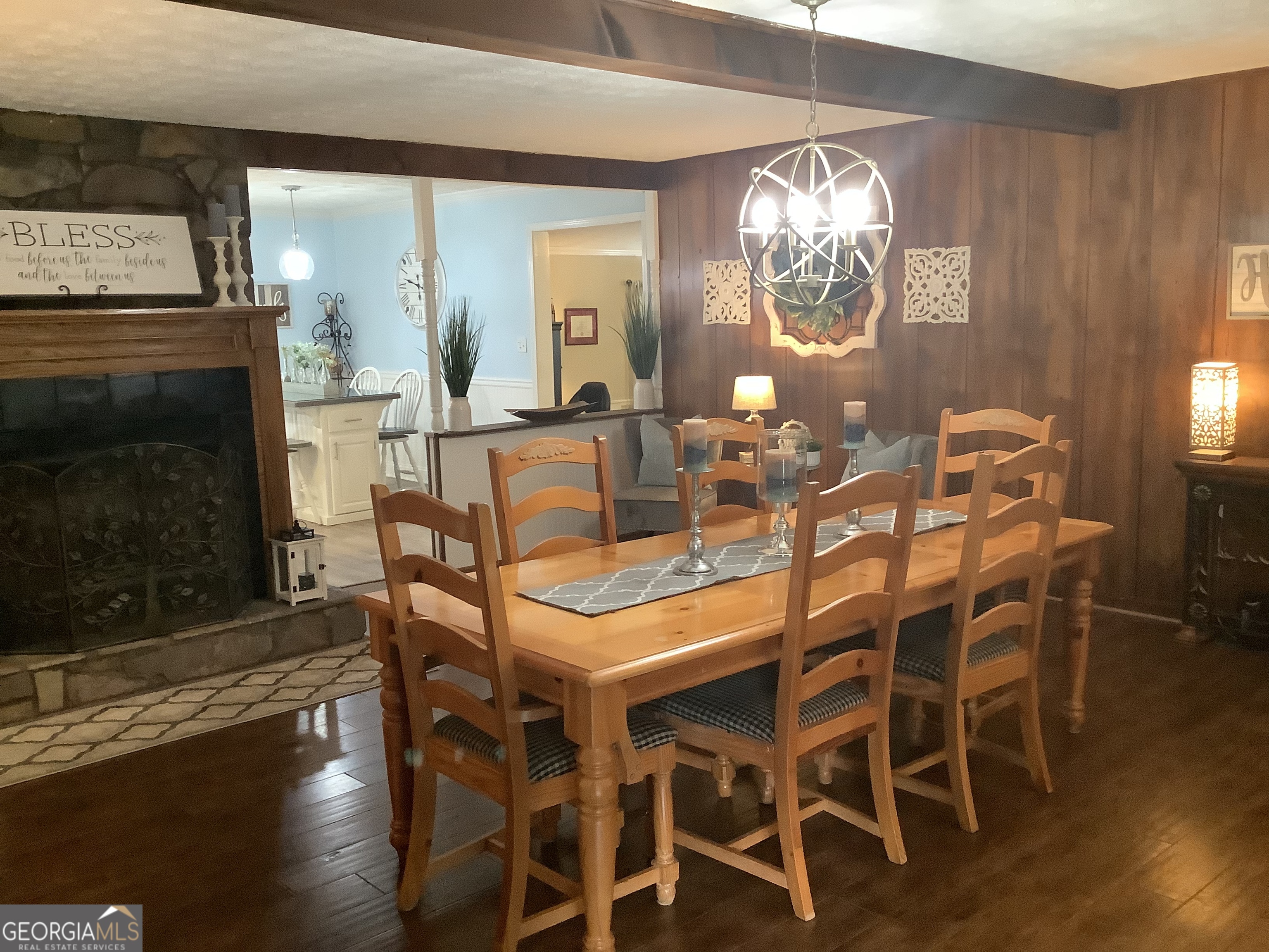 334 Armuchee Trail Northeast Rome, GA 30165 - Photo 15 of 53 a dining room with furniture a chandelier and wooden floor