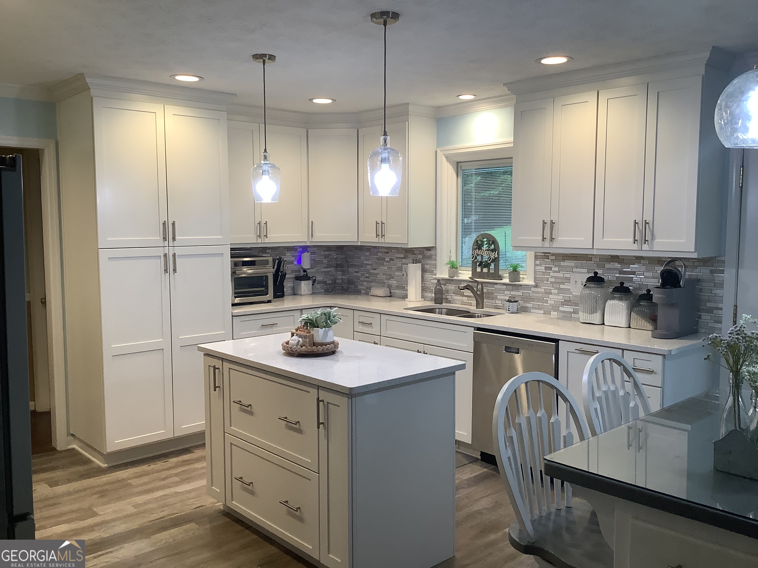 334 Armuchee Trail Northeast Rome, GA 30165 - Photo 17 of 53 a kitchen with a sink stove and cabinets