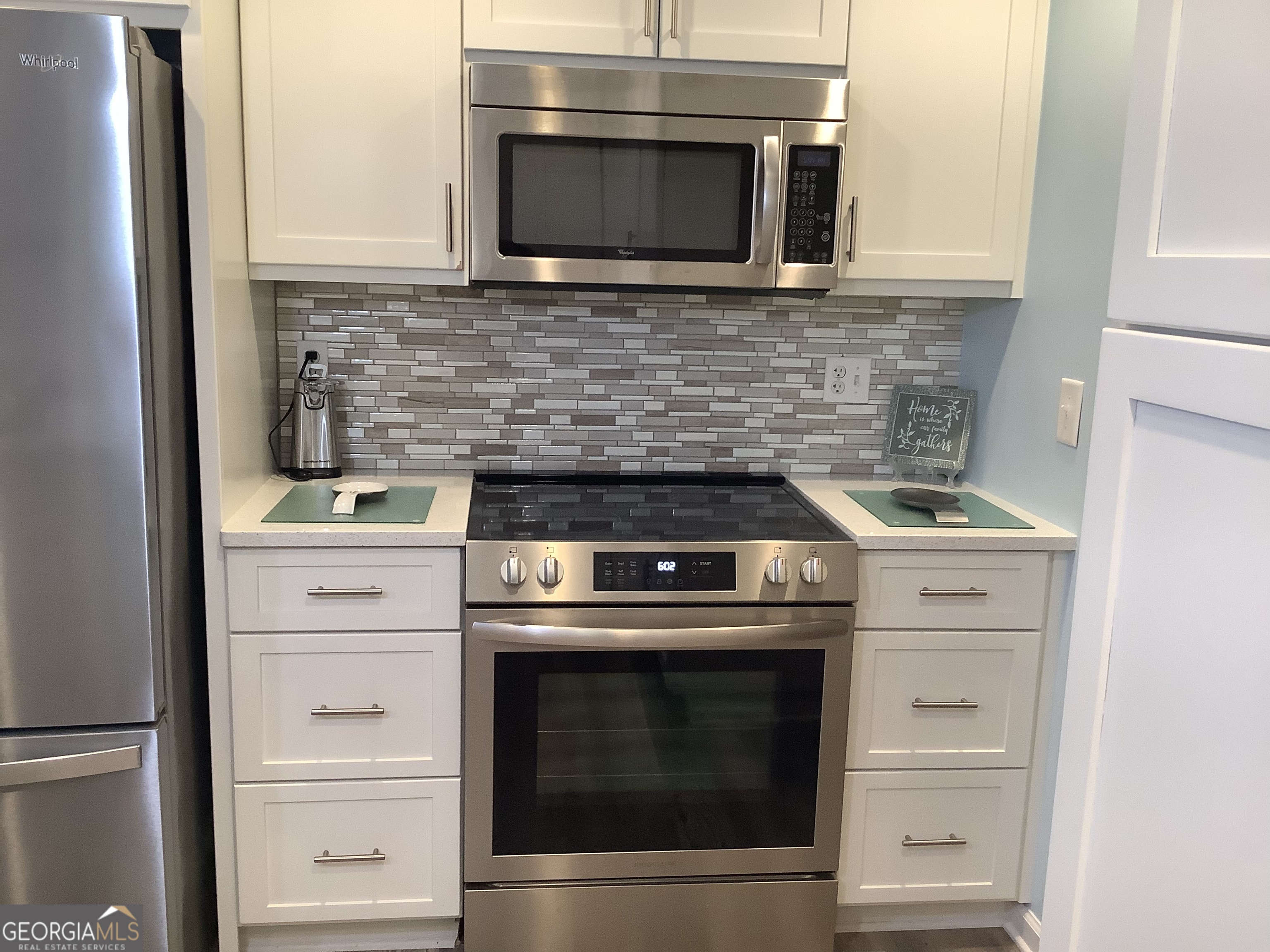 334 Armuchee Trail Northeast Rome, GA 30165 - Photo 23 of 53 a stove top oven sitting inside of a kitchen