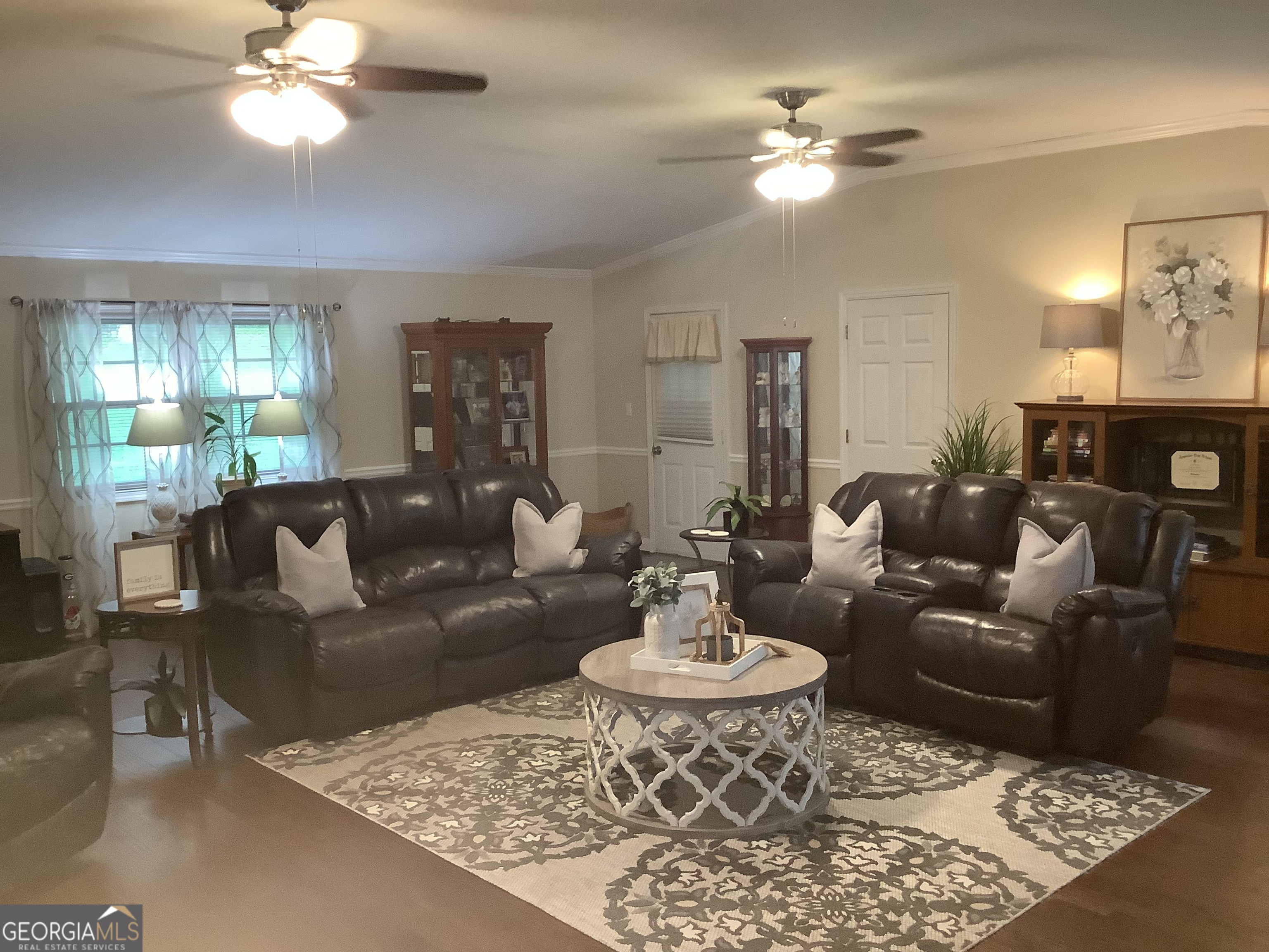 334 Armuchee Trail Northeast Rome, GA 30165 - Photo 25 of 53 a living room with furniture a chandelier and a table