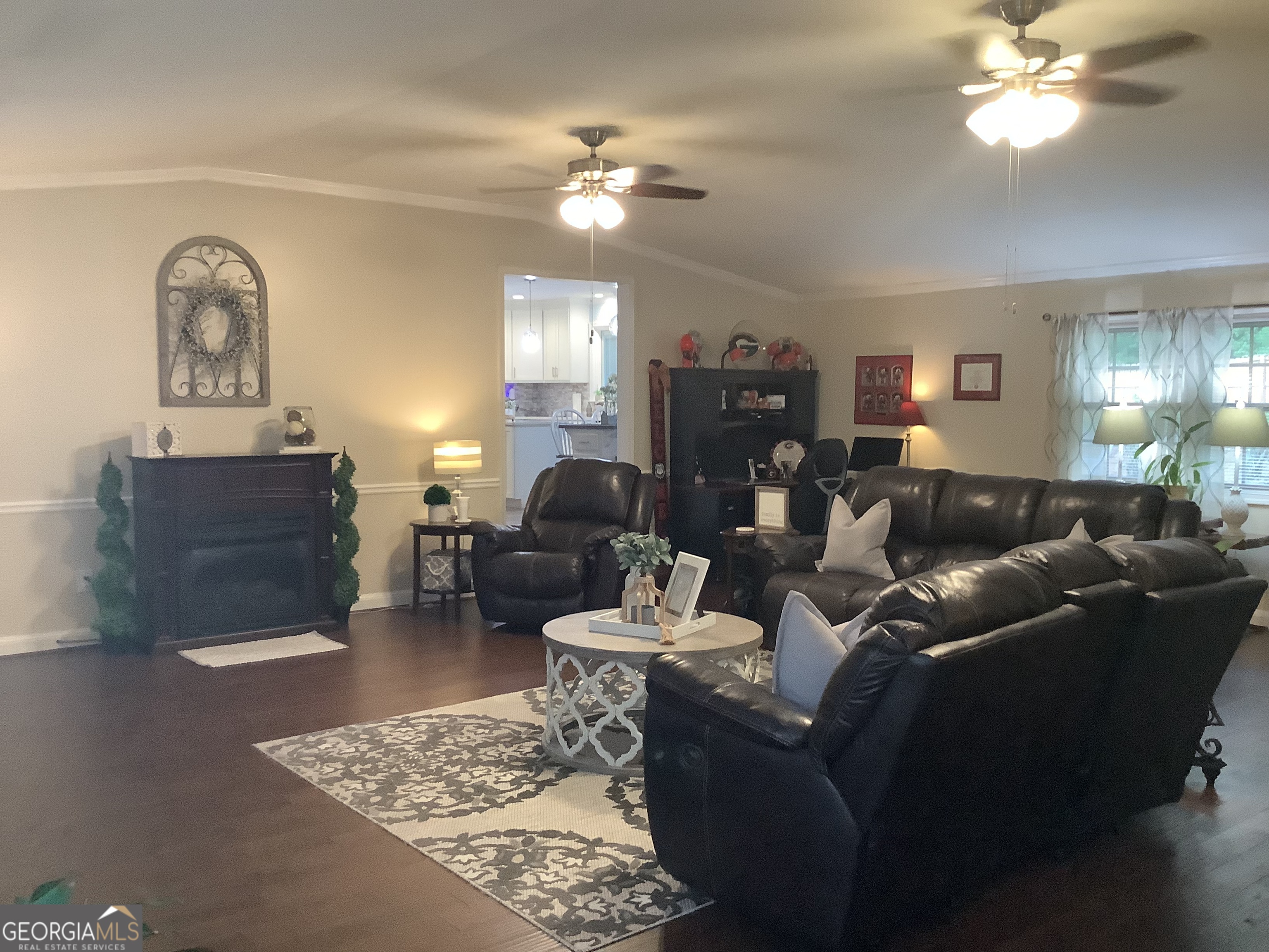 334 Armuchee Trail Northeast Rome, GA 30165 - Photo 26 of 53 a living room with furniture a chandelier and a rug