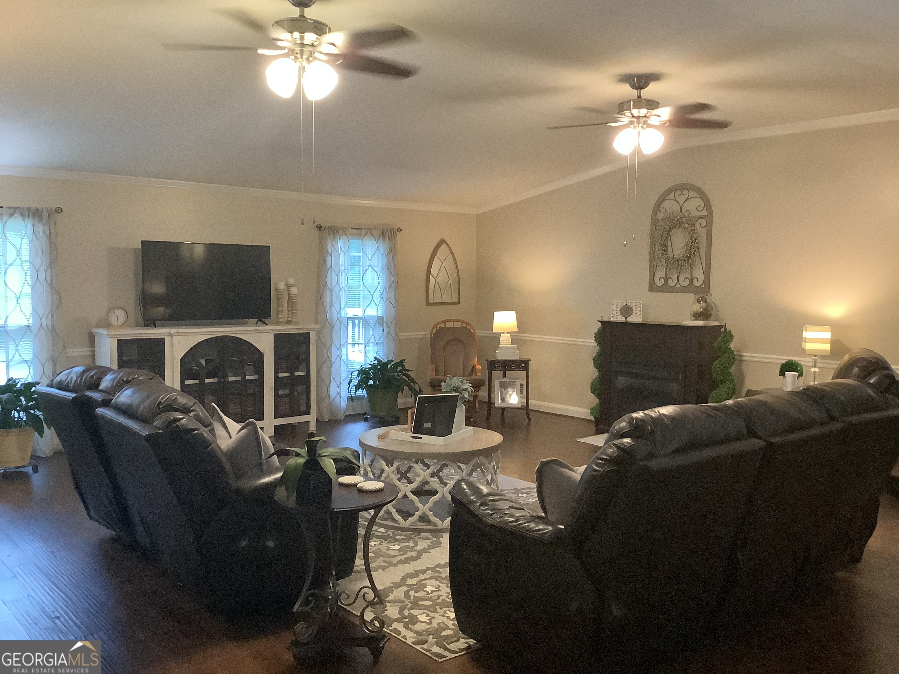 334 Armuchee Trail Northeast Rome, GA 30165 - Photo 27 of 53 a living room with furniture a fireplace and a flat screen tv