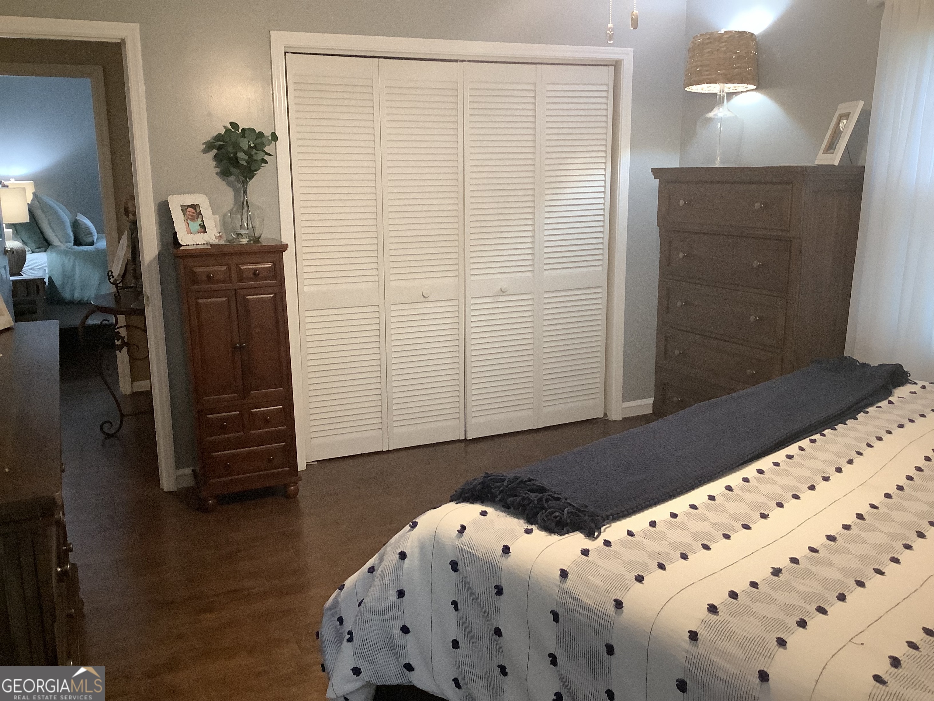 334 Armuchee Trail Northeast Rome, GA 30165 - Photo 30 of 53 a bedroom with a bed and wooden floor