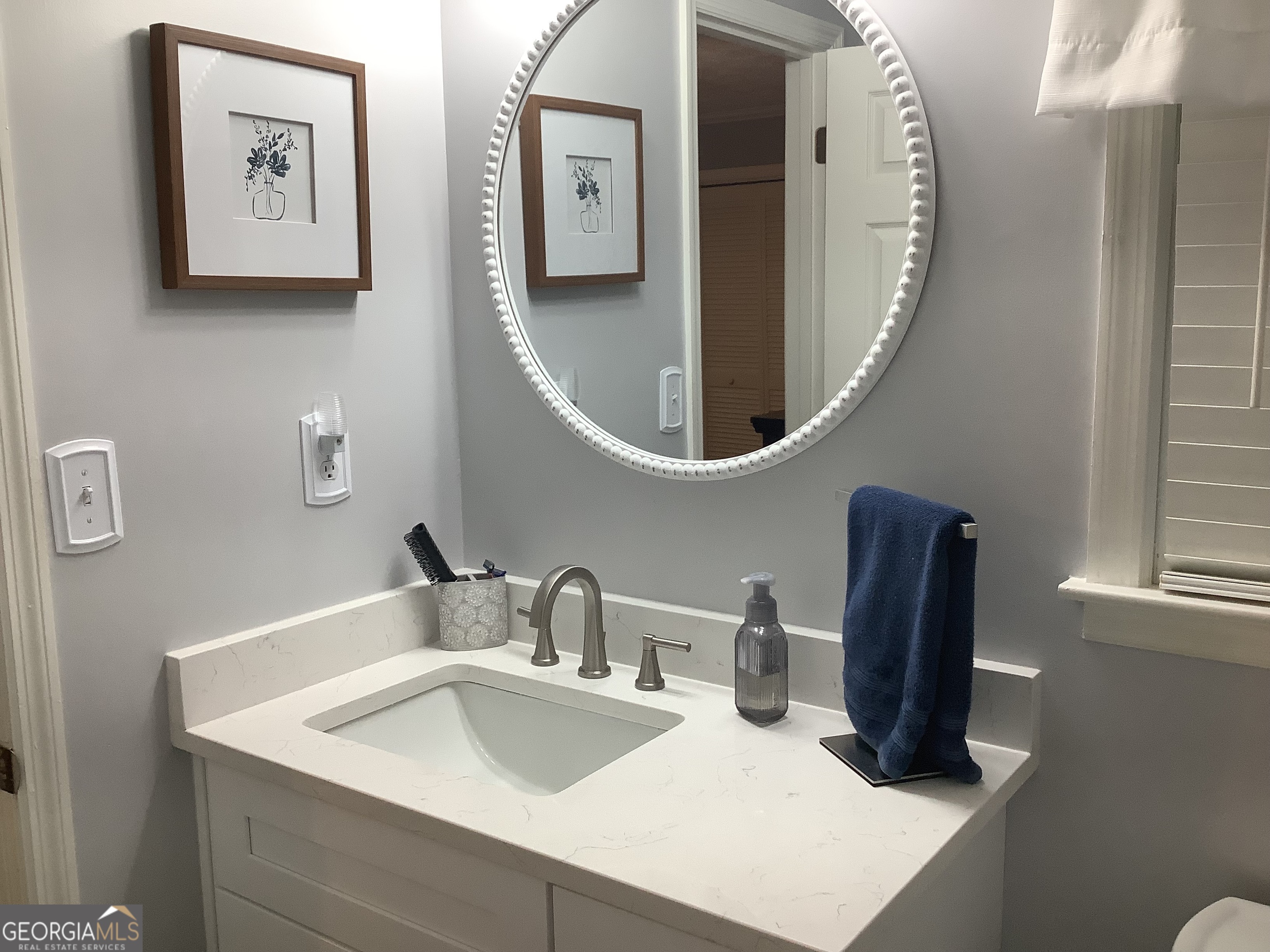 334 Armuchee Trail Northeast Rome, GA 30165 - Photo 33 of 53 a bathroom with a sink and mirror