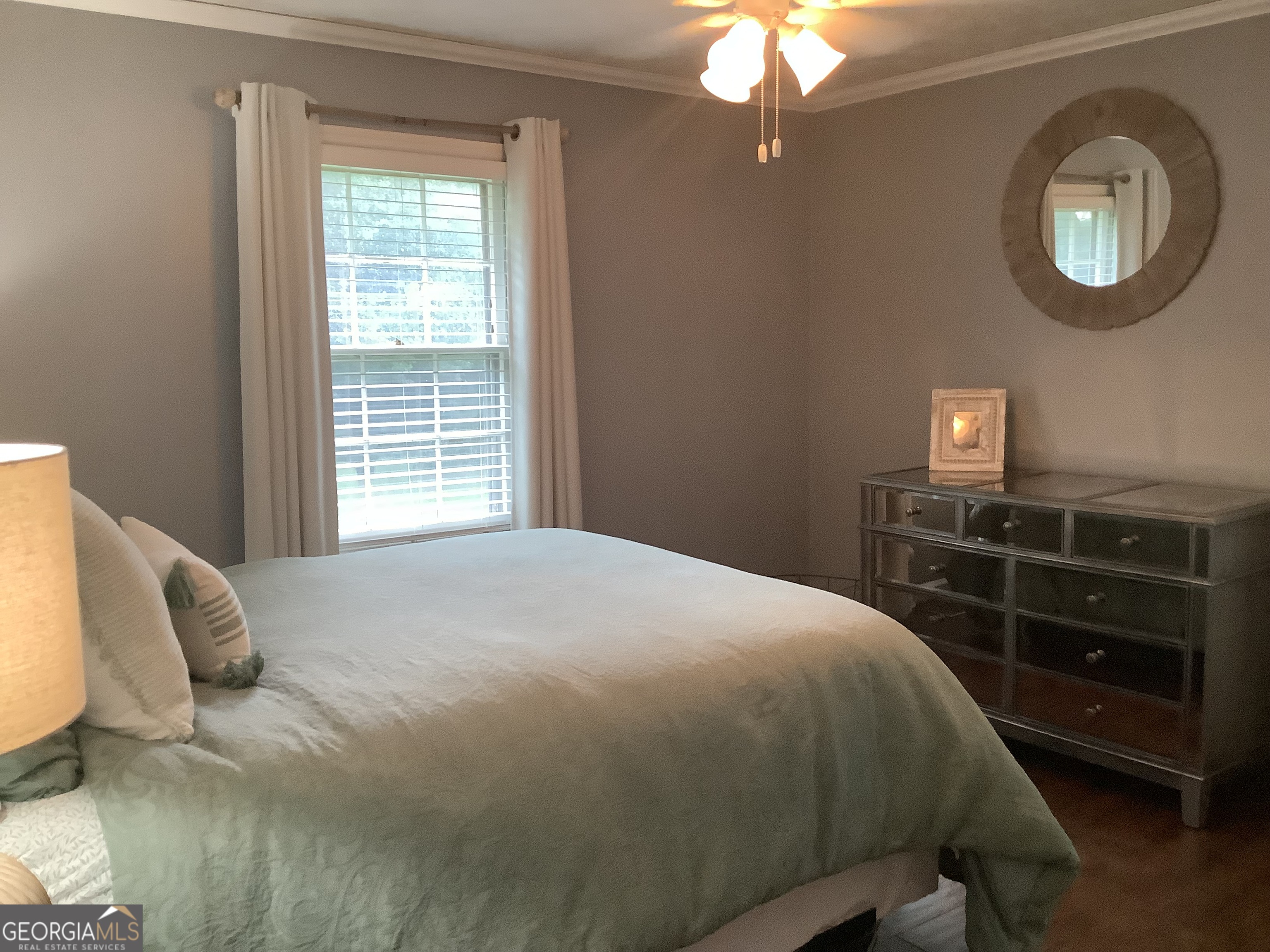 334 Armuchee Trail Northeast Rome, GA 30165 - Photo 36 of 53 a bedroom with a bed and a chandelier