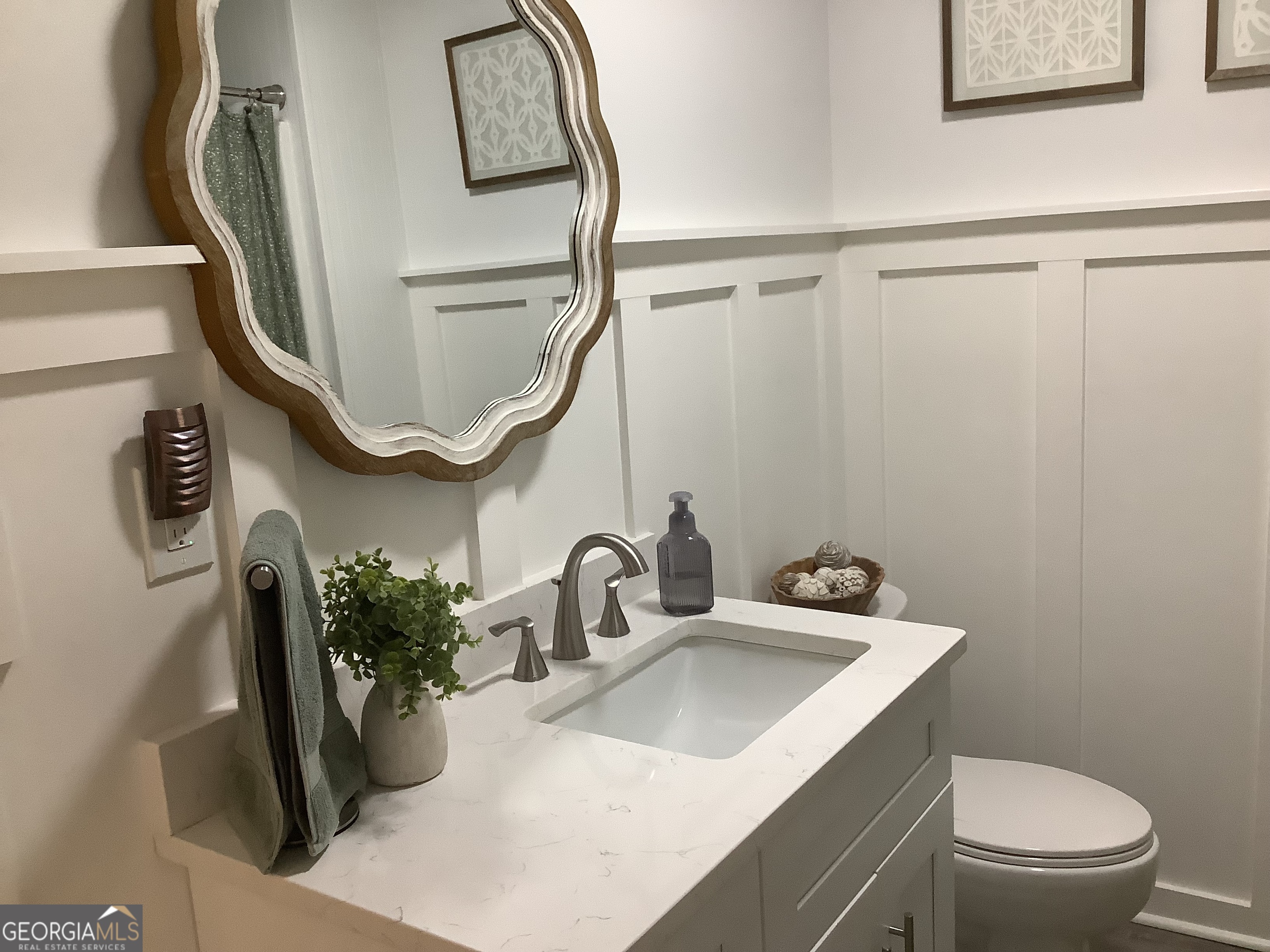 334 Armuchee Trail Northeast Rome, GA 30165 - Photo 37 of 53 a bathroom with a sink a toilet and mirror