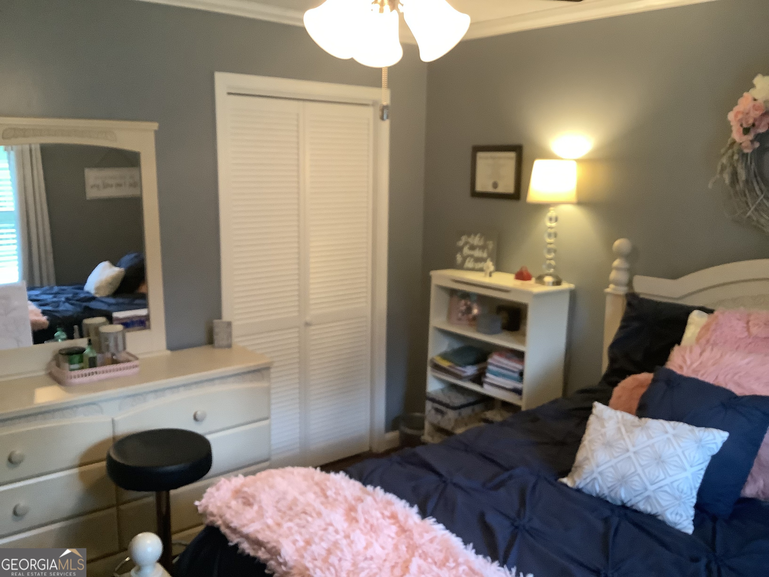 334 Armuchee Trail Northeast Rome, GA 30165 - Photo 40 of 53 a bedroom with a bed and a mirror on the dresser