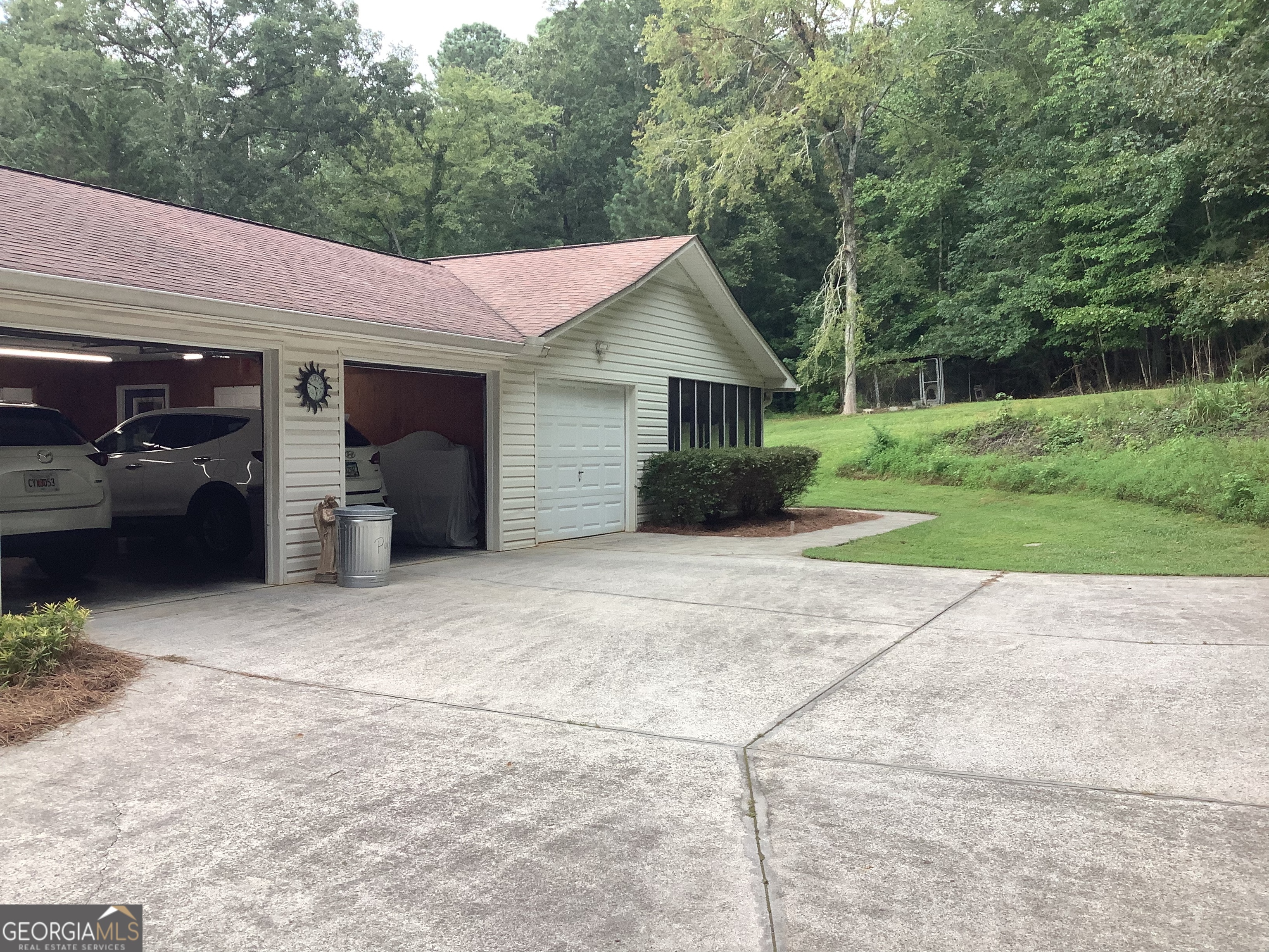 334 Armuchee Trail Northeast Rome, GA 30165 - Photo 4 of 53 a front view of a house with a yard and garage