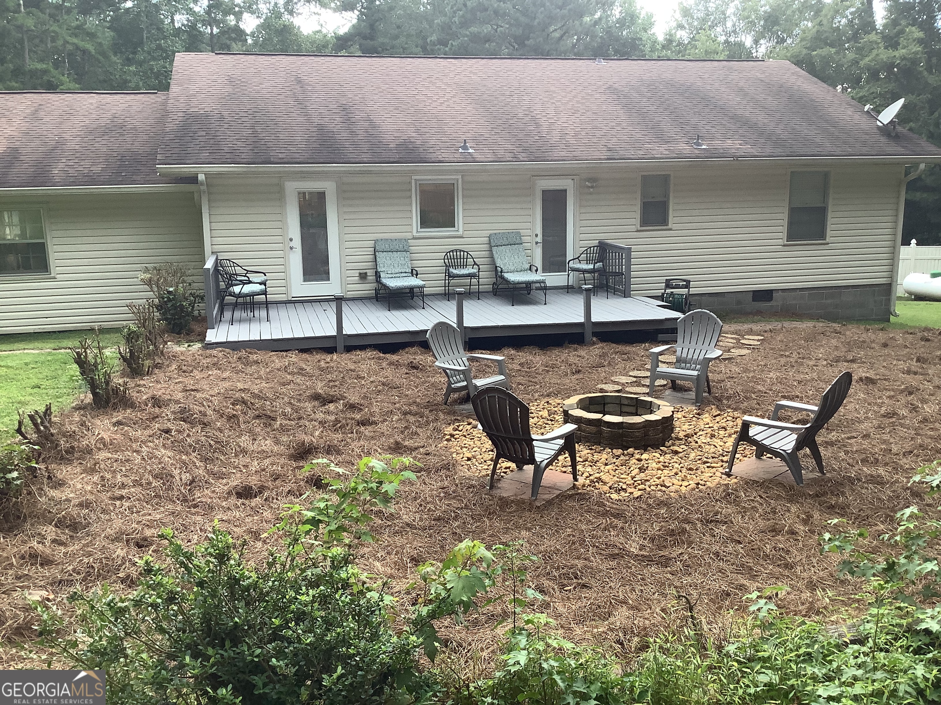 334 Armuchee Trail Northeast Rome, GA 30165 - Photo 8 of 53 a view of a house with backyard and sitting area