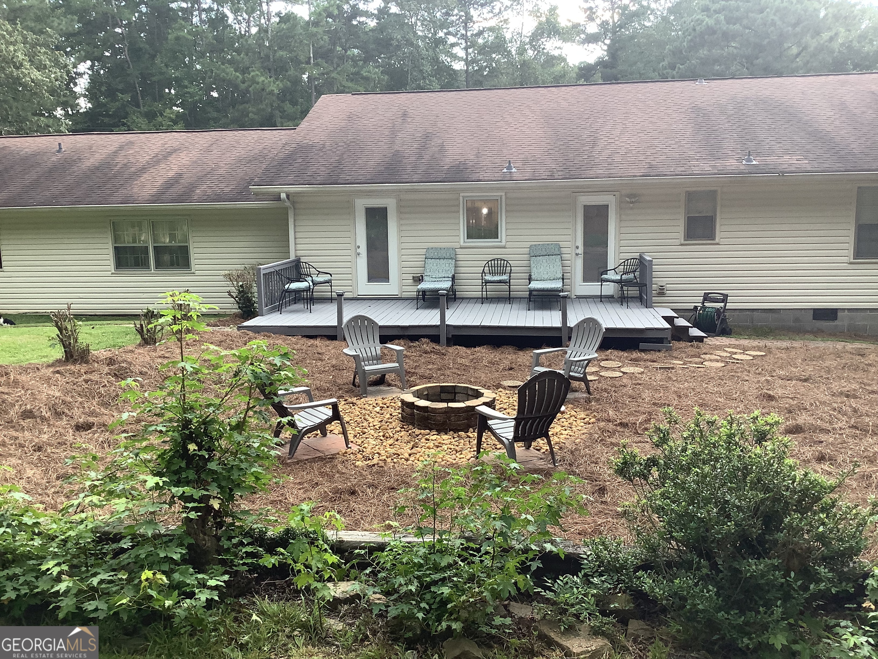 334 Armuchee Trail Northeast Rome, GA 30165 - Photo 9 of 53 a view of a house with backyard sitting area and garden