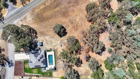a aerial view of a house with a yard